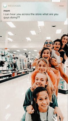 a group of young women standing next to each other in front of an empty store