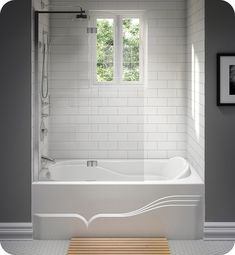 a white bath tub sitting in a bathroom next to a wooden table and framed pictures