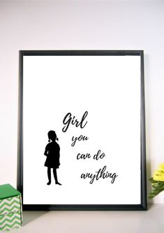 a black and white poster with the words girl you can do anything on it next to some flowers