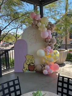 a table with some balloons on top of it