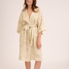 Custom print on linen. Small batch. Luxurious and delicate designs speak of the magic of summer inviting to relax. The robe kimono is cut for a relaxed fit, ensuring it looks flattering on many body shapes. It features generous kimono proportions and is fastened with a linen sash tie.   Linen is a naturally anti-static fabric that collects less dust and is therefore healthier for you. Linen is a 100% plant-based fabric. Its cultivation and production conserves water, does not pollute, does not l Elegant Linen Dress With Floral Print, Elegant Linen Summer Robe, Beige Spring Dress With Kimono Sleeves, Beige Linen Robe For Spring, Elegant Summer Linen Robe, Elegant Cream Linen Daywear Dress, Beige Linen Spring Robe, Spring Beige Linen Robe, Elegant Cream Linen Day Dress