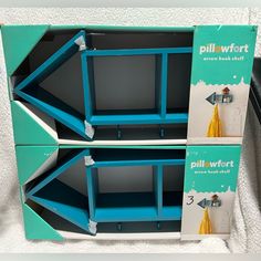 two blue shelves with yellow tassels on each shelf and the bottom one is empty