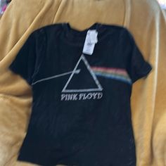 a pink floyd t - shirt with the dark side of the moon on it