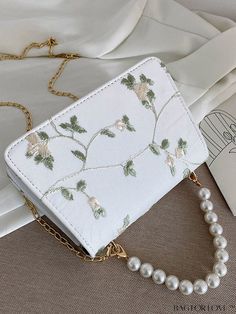 BagForLove - Compact Square Bag with Elegant Floral Embroidery and Faux Pearl Detailing Product Description Color White Details Pearls Type Square Bag Bag Size Mini Strap Type Top Handle Pattern Type Floral Style Fashionable Closure Type Flap Material PU Leather Size Chart INCH CM Strap Length Bag Length Bag Width Bag Height Handle Height 41.7 inch 7.5 inch 2.2 inch 4.9 inch 3.9 inch Strap Length Bag Length Bag Width Bag Height Handle Height 106 cm 19 cm 5.5 cm 12.5 cm 10 cm Details Pictures Sim White Wedding Bags For Spring, Rectangular Bags With Pearl Embroidery, White Bag With Pearl Embroidery For Everyday Use, White Embroidered Shoulder Bag, White Pearl Embroidered Bag For Everyday Use, Elegant White Embroidered Shoulder Bag, White Embroidered Bags For Spring, Embroidered Crossbody Bag For Spring, Rectangular Wedding Bags For Spring