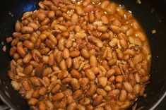 some beans are cooking in a pan on the stove