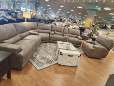 a large sectional couch in a furniture store