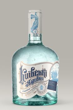 a bottle of rum with a blue label on the top and bottom, sitting in front of a gray background