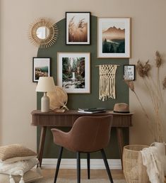 a desk with some pictures on the wall above it and a chair next to it