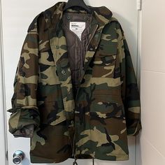 Brand New, Never Worn. No Wear Or Tear. Great Quality. Camouflage Jacket With Hoodie In Zip Collar, Waist Drawstrings, Snap And Zip Closure, Detachable Insulated Lining (Can Be Worn Separately). Can Be Worn In Multiple Seasons. Men’s Size Medium For Baggy Look. Fits Like A Women’s Large Or Xl, Depending On Your Shape. Can Be Worn As Shown In Last Picture (For Style Purposes Only). Measurements: Men’s Medium Chest. 25.0 Sleeve 32.50 Back 32.50 Camouflage Hooded Outerwear With Detachable Hood, Winter Military Camouflage Hooded Jacket, Winter Military Camouflage Parka, Winter Camouflage Windbreaker With Pockets, Camouflage Winter Streetwear Outerwear, Camouflage Outerwear For Winter Streetwear, Camouflage Outdoor Outerwear With Detachable Hood, Camouflage Windbreaker For Winter Hunting, Winter Camouflage Windbreaker For Hunting