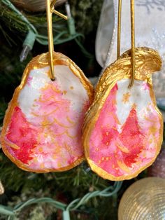 pink and gold earrings hanging from a christmas tree