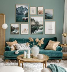 a living room filled with green couches and pictures on the wall above them,