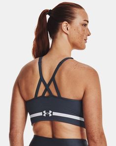 Delivers strategic support, tailored for low-impact activities like yoga, pilates & hiking|UA Seamless is a soft knit with engineered ventilation, mapped to the places you need it most|Soft, removable cups for enhanced shape & coverage|Skinny strap pullover with adjustable cross back design|Wide jacquard wordmark band for amazing stretch & comfort|Material wicks sweat & dries really fast|4-way stretch material moves better in every direction Sporty Seamless Medium Support Activewear, Gray Seamless Activewear With Medium Support, Technical Activewear With Medium Support And Seamless Construction, Under Armour Athleisure Activewear With Medium Support, Medium Support Gray Seamless Activewear, Supportive Athleisure Activewear By Under Armour, Gray Seamless Medium Support Activewear, Breathable Under Armour Activewear For Workout, Functional Seamless Activewear For Running