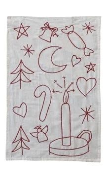 a white towel with red thread on it and various symbols in the shape of a candle