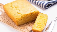 a loaf of cornbread sitting on top of a cutting board