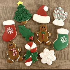 decorated christmas cookies on a wooden table