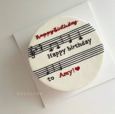 a happy birthday cake with music notes on it