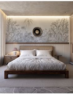 a bedroom with a large bed and wallpaper