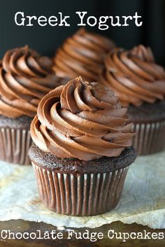 chocolate fudge cupcakes on a table with the words greek yogurt