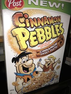 a box of cinnamon pebbles sitting on top of a shelf in a store