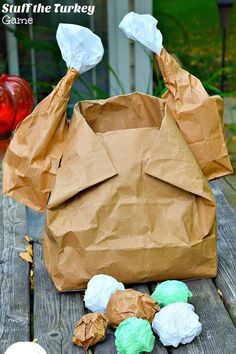 a brown paper bag sitting on top of a wooden table