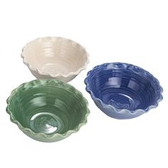 three bowls are sitting side by side, one is blue and the other is green