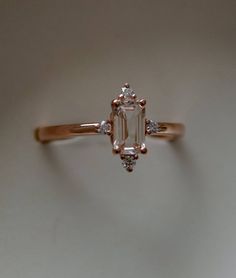 Peach sapphire engagement ring. Promise ring. Emerald cut | Etsy Rose Gold Emerald Cut Sapphire Promise Ring, Emerald Cut Rose Gold Sapphire Promise Ring, Classic Emerald-cut Rose Gold Sapphire Ring, Classic Emerald Cut Sapphire Ring In Rose Gold, Promise Ring Emerald, Different Engagement Rings, 5 Stone Ring, Jewelry Rings Unique, Peach Sapphire Engagement Ring