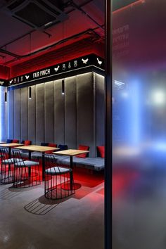 an empty restaurant with red and blue lighting