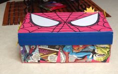 a spiderman themed box sitting on top of a table