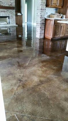 a kitchen floor that has been cleaned and is in the process of being polished with concrete