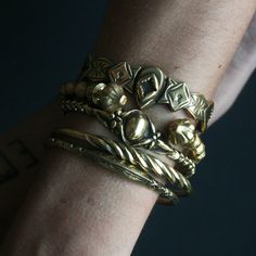 WE ARE CURRENTLY SHIPPING ALL OUR ORDERS VIA DHL EXPRESS TO MAKE SURE THAT YOUR ORDERS ARE DELIVERED SUPER SAFE AND SUPER FAST! *MAKE SURE TO INCLUDE YOUR PHONE NUMBER IN THE 'NOTE TO SELLER' FIELD AT CHECKOUT ! Handcrafted solid yellow bronze open back engraved cuff with intricate designs inspired by nature. Features two snake heads at the back which makes it equally perfect to wear that side on top. The metal has been oxidized and engraved for an antique look then polished for a beautiful burn Antique Gold Cuff Bracelet Collectible, Heirloom Brass Gold Bracelets, Heirloom Gold Brass Bracelets, Gold Victorian Cuff Bracelet With Intricate Design, Vintage Yellow Gold Brass Bangle, Antique Finish Brass Gold Bracelet, Antique Finish Gold Brass Bracelet, Antique Finish Brass Bracelet In Gold, Gold Ornate Brass Cuff Bracelet