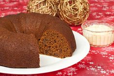 a bundt cake on a white plate with a slice cut out