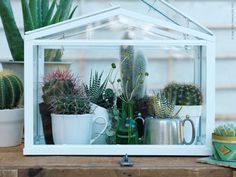 there is a small white house with plants in it and the words simple greenhouse written below