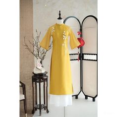 👉 7 DAY REFUND SUPPORT FOR CUSTOMERS IN VIETNAM * Still a Vietnamese girl walking down the street, how beautiful are her innovative ao dai. Selected from the best materials, the 4-piece modern ao dai will bring her the perfect experience. * With a delicate ao dai design in the flower-embroidered sleeves, a little bit of momentum with a stylized side part, this innovative ao dai can turn any girl into a beautiful lady. , young, lovely. * Ao dai in different colors such as pink and beige helps he Yellow Dress With Gold Embroidery For Festivals, Yellow Dresses With Gold Embroidery For Festivals, Spring Dresses With Gold Embroidery, Formal Embroidered Ao Dai For Spring, Formal Spring Embroidered Ao Dai, Spring Formal Embroidered Ao Dai, Embroidered Ao Dai For Spring Formal, Yellow Kurta With Gold Embroidery, Traditional Ceremonial Dress For Spring