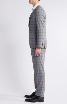 Patterned in a tonal plaid, this suit tailored from a wool-forward blend kissed with touch of stretch makes a versatile addition to your formal wardrobe. Jacket has notched lapels; four-button cuffs; chest pocket; welt pockets; side vents Trousers have zip fly with button-tab closure; slant pockets; back button-welt pockets Jacket is lined 60% virgin wool, 38% polyester, 2% elastane Dry clean Made in Turkey Plaid Wool Suit With Notch Lapel, Timeless Plaid Suit With Notch Lapel, Timeless Plaid Suits With Notch Lapel, Fitted Plaid Timeless Blazer, Timeless Fitted Plaid Suit, Fitted Timeless Plaid Suit, Timeless Fitted Plaid Blazer, Tailored Plaid Suit With Notch Lapel, Timeless Plaid Suit For Work