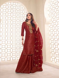 This Malaika Arora Maroon Zari Woven Yoke Design Embroidered Straight Kurta set features true craftsmanship in a luxurious silk blend design. Embellished with intricate Zari, this sharara is perfect for ethnic events and winter parties. Ready-to-wear, it features a round neck and three-quarter sleeves, with side slits for extra comfort. Grandeur and majestic artwork is attributed to this exquisite creation by Malaika Arora. TOP: Silk Blend(Brocade), TOP INNER: Cotton, BOTTOM: Silk Blend(Brocade) Western Kurtis, Brocade Top, Yoke Design, Malaika Arora, Ethnic Motifs, Winter Parties, A Line Kurta, Elegant Sets, Anarkali Suit