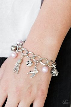 Pink pearls, ornate silver beads, and white rhinestone encrusted accents swing from a dramatic silver chain. A shimmery silver bird charm and silver tassel are added to the display, creating a whimsical fringe around the wrist. Features an adjustable clasp closure. Pink Charm Bracelet, Dove Bracelet, Pink Charm, Pink Jewels, Silver Bird, Pink Pearls, Bird Charm, Paparazzi Accessories, Blue Gems