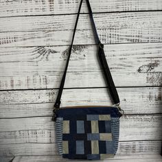 Denim Patchwork Shades of Blue Crossbody Bag With Adjustable Strap Measures approximately 9"Hx13"Wx4"D Adjustable strap 28"-55" This is a lightweight crossbody bag that consists of various denim pieces.  - 1 main zippered section - 1 exterior zippered pocket - Interior slip pockets - Adjustable, removable strap This crossbody bag is ready to be shipped! Daily Use Denim Blue Shoulder Bag With Adjustable Strap, Denim Crossbody Shoulder Bag For Travel, Denim Blue Crossbody Shoulder Bag For Daily Use, Rectangular Denim Shoulder Bag With Adjustable Strap, Blue Denim Shoulder Bag With Adjustable Strap, Denim Blue Crossbody Shoulder Bag For Everyday, Everyday Denim Blue Crossbody Shoulder Bag, Denim Blue Shoulder Bag With Zipper For Everyday Use, Blue Denim Rectangular Satchel