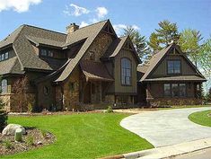 a large house with lots of windows in the front yard