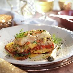 a white plate topped with food on top of a table