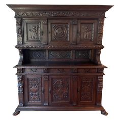 an old wooden cabinet with carvings on it