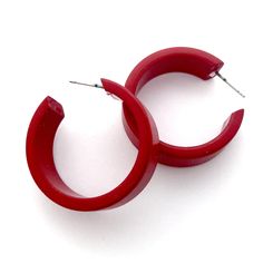 Deep red opaque lucite hoop earrings in a straight & sturdy shape with a shiny finish. This style is known as the 'Chandler Hoop' (formerly known as the Small Portland Hoop) and comes in 2 sizes. The larger one is the Portland Hoop. This is the smaller of the 2, but is in no way a small hoop. It measures about 30mm or 1.25" in diameter & 10mm in width. One of our favorite styles & comes in many colors. Jewelry is designed & hand finished by us, here in the US. Most all are made w Red Small Hoop Earrings For Everyday, Small Red Hoop Earrings For Everyday Wear, Modern Red Small Hoop Earrings, Modern Small Red Hoop Earrings, Trendy Red Hoop Earrings For Everyday, Modern Lucite Hoop Earrings, Lucite Hoop Earrings As Gift, Modern Small Hoop Plastic Earrings, Modern Plastic Hoop Earrings