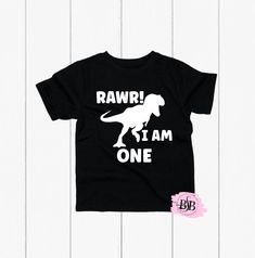 Rawr I'm One, Dinosaur Birthday, 1st Birthday Shirt, 1st Birthday, Dinosaur Shirt, First Birthday Shirt Boy, Rawr I'm One Shirt,Dinosaur Tee The design is adhered to the shirt with a premium professional heat press for optimum quality! I use TOP Quality Shirts. The shorts are NOT INCLUDED with this purchase.  The shirts are VERY SOFT!! The shirts are true to size. Shirts ship out within 1 business days (MON-FRI) or less and take an additional 2-5 days to arrive. Each shirt is custom and made special just for your little one.  Subscribe to Our Youtube Channel: BiteSizeBlessin https://www.youtube.com/channel/UCgIwKj2LgETFAzb_VbzKf2w Follow us on Instagram (@bitesizeblessin) for giveaways, exciting news, and the first to know about new products. Please verify that your mailing address is corr Three Dinosaur Birthday, Birthday Dinosaur Shirt, Third Birthday Shirt, Cookie Monster Birthday, Birthday Dinosaur, Dinosaur Tee, 2nd Birthday Shirt, 1st Birthday Shirts, First Birthday Shirts