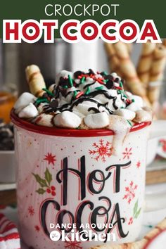 there is a hot cocoa drink with marshmallows in it and the words crockpot hot cocoa on top