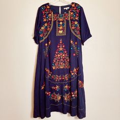 Beautiful Blue Embroidered Midi Dress Size Large New With Tags. Dress Is Lined Blue Floral Embroidery Midi Dress, Blue Floral Print Embroidered Midi Dress, Blue Folk Dress For Spring, Blue Floral Embroidery Short Sleeve Dress, Blue Bohemian Midi Dress With Floral Embroidery, Bohemian Blue Midi Dress With Floral Embroidery, Blue Bohemian Dress With Geometric Embroidery, Bohemian Blue Dresses With Geometric Embroidery, Bohemian Midi Dress With Floral Embroidery And Short Sleeves