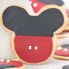 decorated cookies with mickey mouse's ears are on display for the guests to enjoy