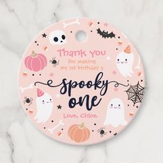 a pink halloween themed birthday party plate with the words, thank you for making my 1st birthday spooky one