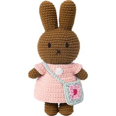 a crocheted stuffed animal with a pink dress on it's chest, holding a purse