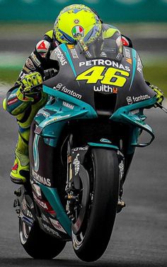 a person riding a motorcycle on a race track