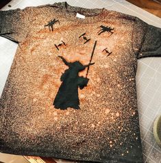 a t - shirt with the image of darth vader on it is shown