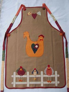 the apron is decorated with farm animals and hearts